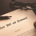 Last Will and Testament document with pen and glasses