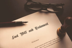 Last Will and Testament document with pen and glasses