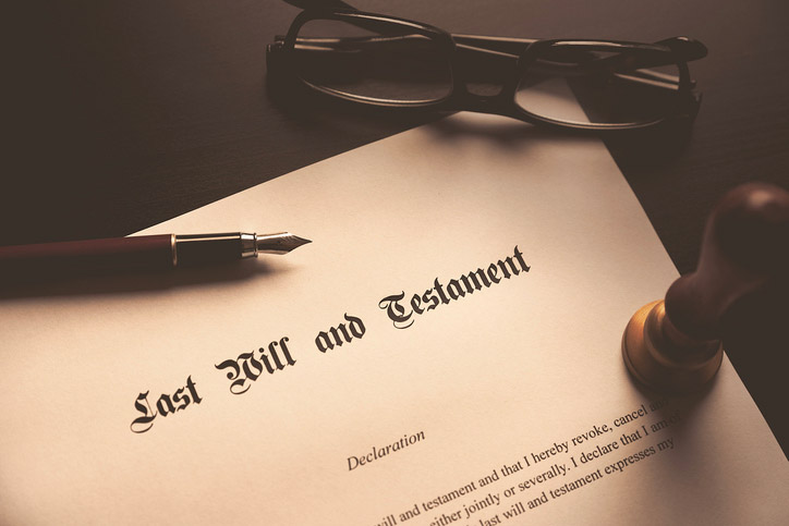 Last Will and Testament document with pen and glasses